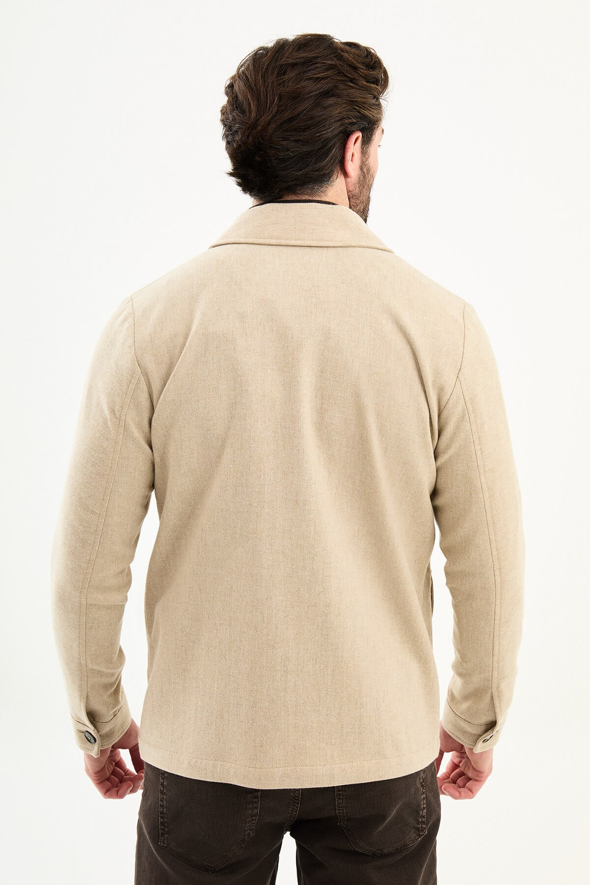Men’s beige wool blend utility jacket with button-up front and four pockets, regular fit smart casual layering jacket styled with brown trousers and dark turtleneck sweater