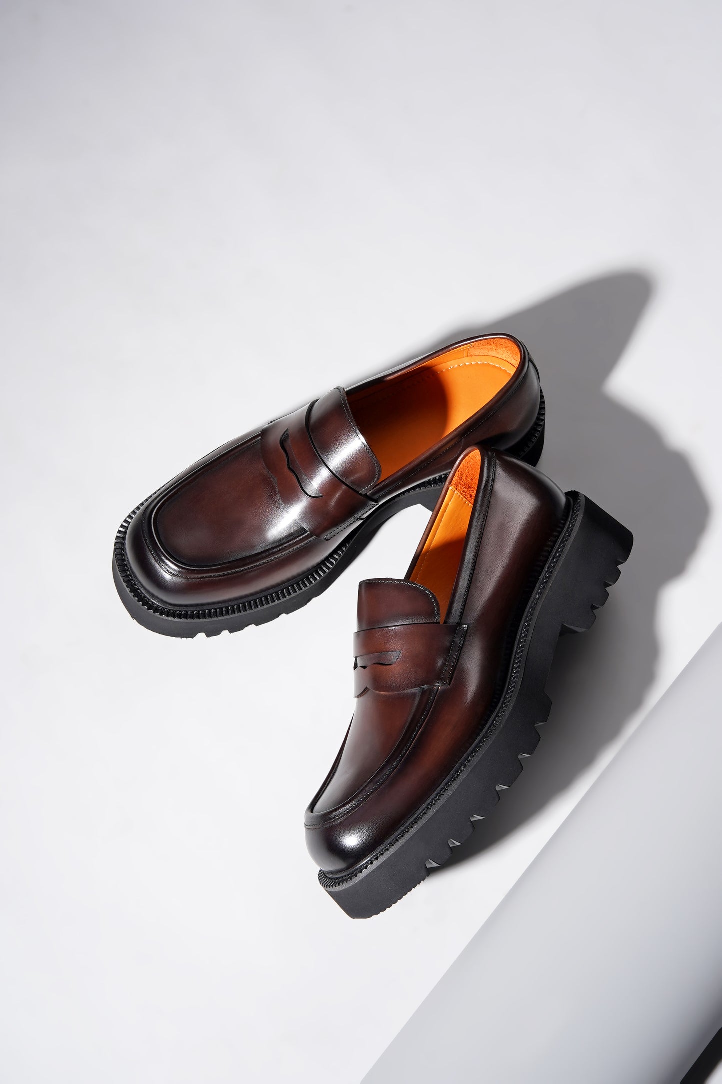Pair of brown leather penny loafers with EVA sole