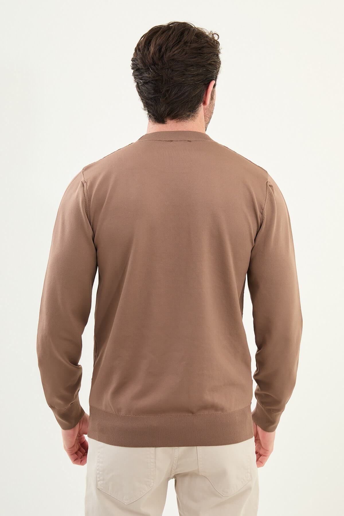 Men’s camel textured crew neck sweater with geometric knit pattern, slim fit smart casual knit styled with beige trousers