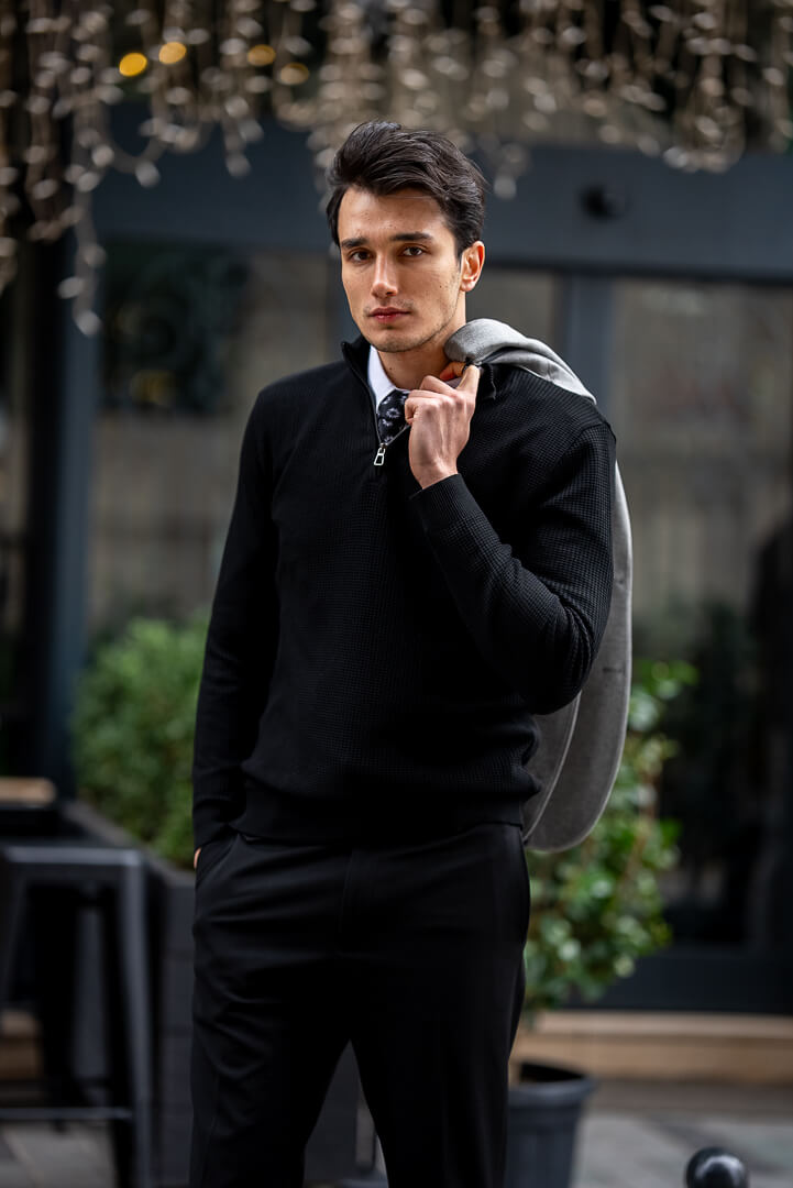 black sweater dress shirt Men's Outfit: Black V-neck Sweater, Blue Denim Shirt, Khaki Chinos, Black Leather High Top Sneakers