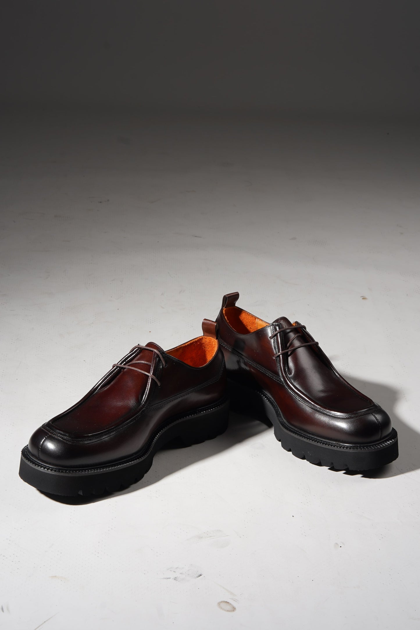 Angled pair view of Bordeaux Split-Toe Derby Shoes highlighting craftsmanship and Bordeaux hue.