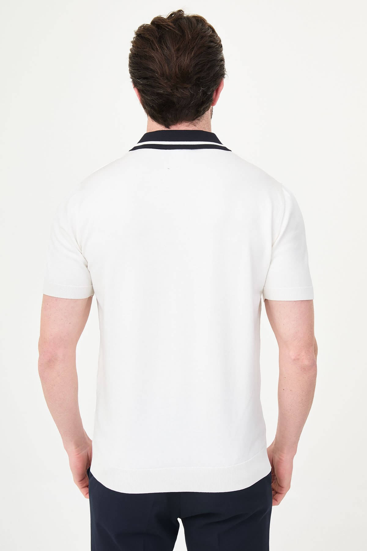 Men’s white short sleeve knit polo shirt with button front, contrast tipped collar, textured side panels, slim fit smart casual style