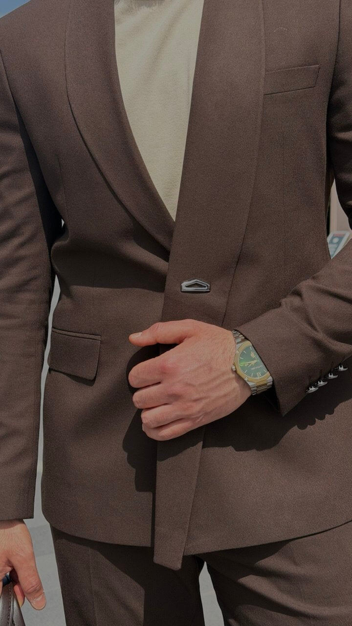 Men’s brown slim fit tailored suit with modern structure, styled with loafers and minimal outfit