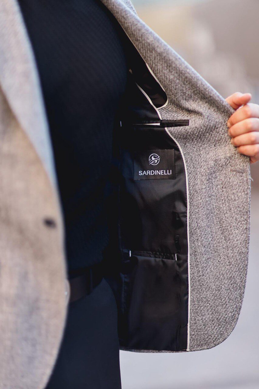 Men’s gray textured mono-collar slim-fit jacket styled with black turtleneck