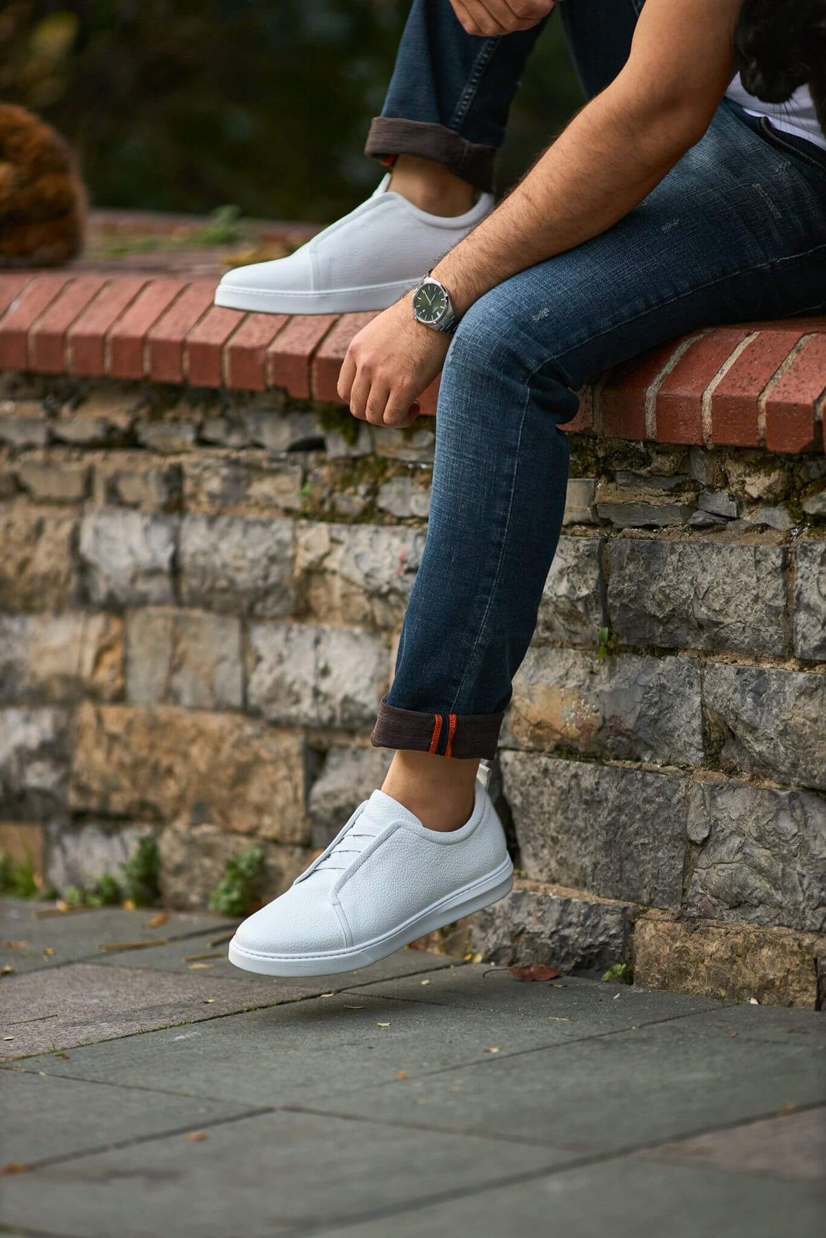 Men's white court sneaker with subtle lace detailing, front view