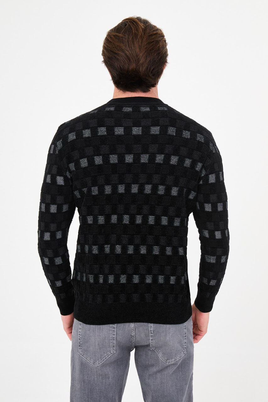 Men's black checkered textured crew neck knit sweater with patterned design for fall winter menswear.