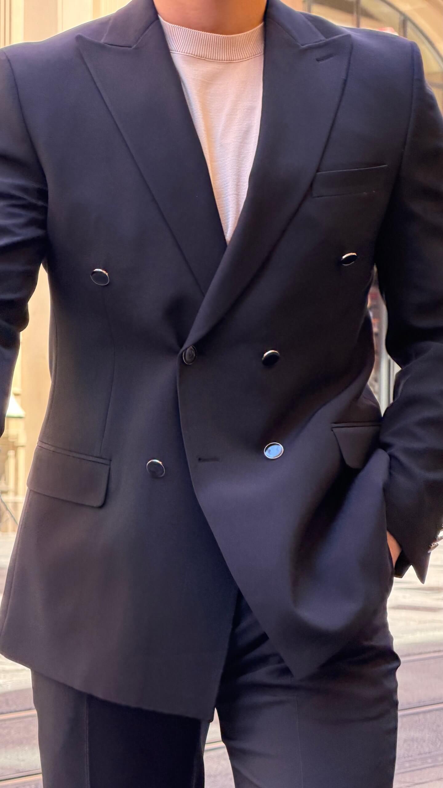 Men's black double breasted suit with tailored jacket and matching trousers