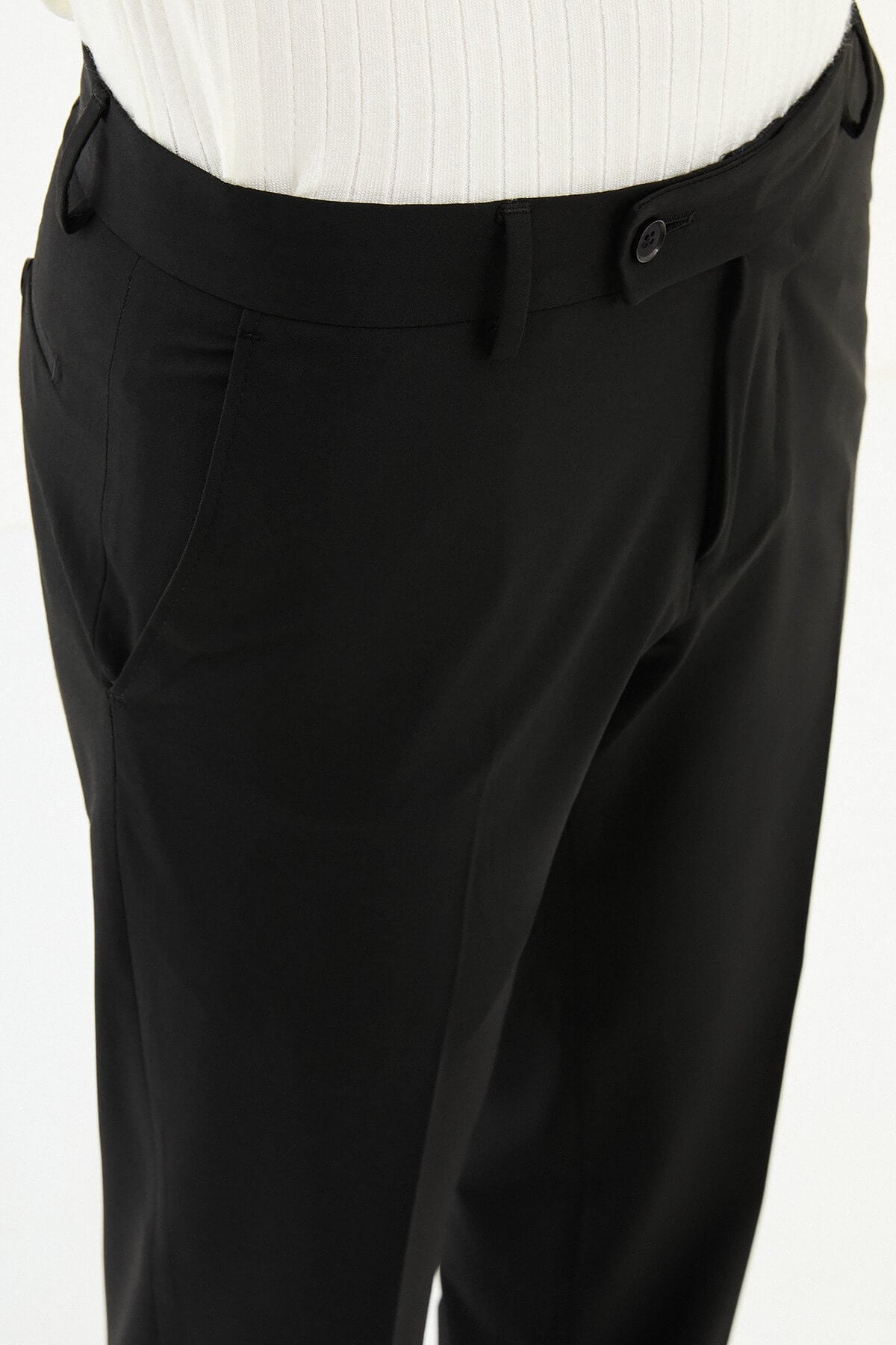 Men wearing black slim-fit formal trousers with black dress shoes, styled for professional and formal summer settings.