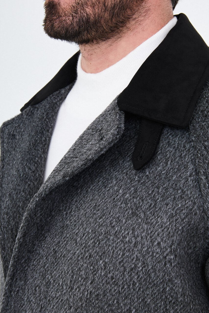 Men's dark grey wool overcoat with stand collar, button-front fastening, and tailored silhouette.