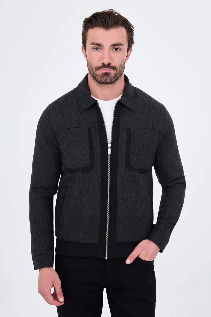 Black wool-blend men's jacket styled with a white T-shirt and black trousers.