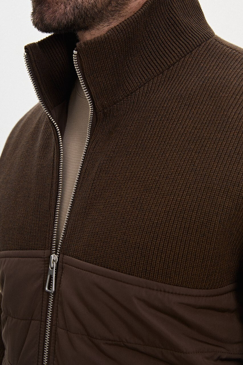 Brown men's casual jacket styled with a neutral top and dark trousers.