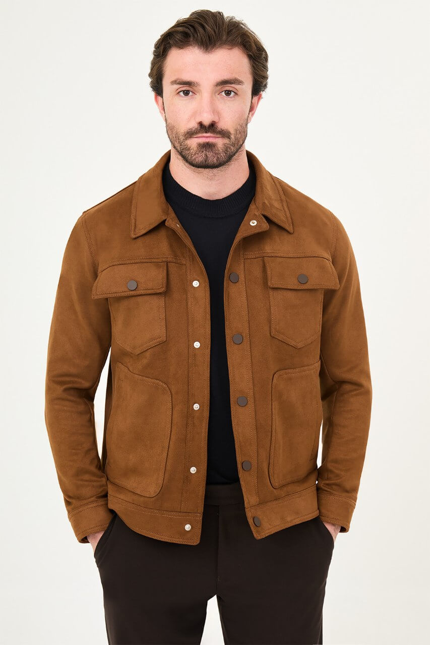 Men's camel suede-style jacket styled with a black sweater and dark trousers.