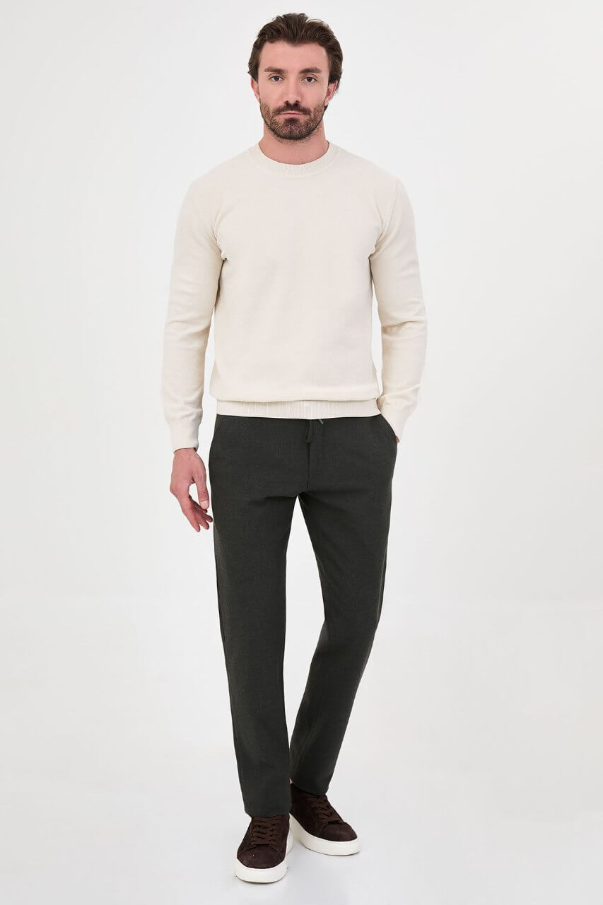 Men’s ecru crew neck knit sweater in a cotton blend slim fit design styled for a refined fall winter outfit.