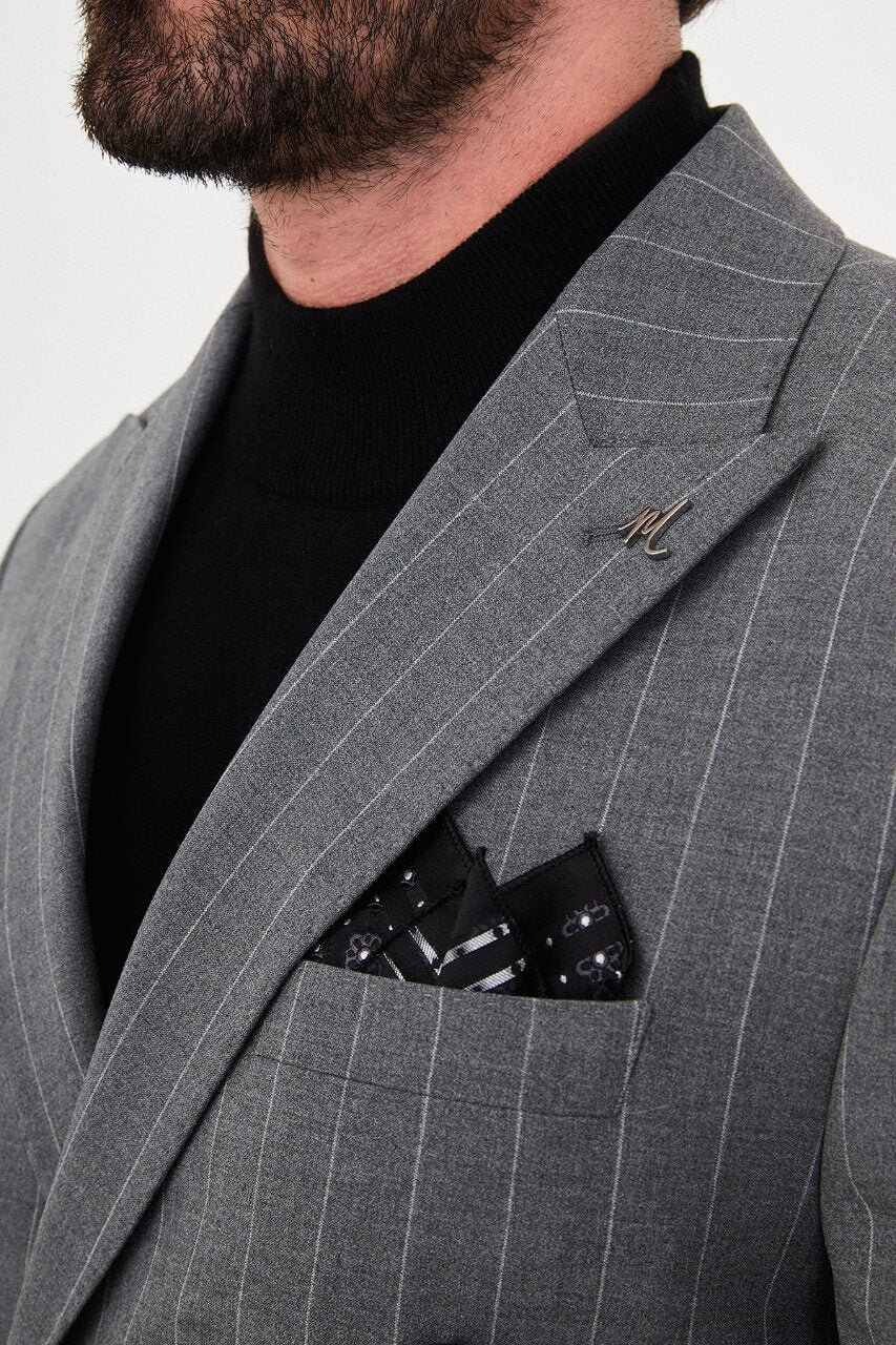HolloMen men's grey pinstripe double-breasted suit with peak lapels, six-button jacket, and matching trousers styled with a black turtleneck.