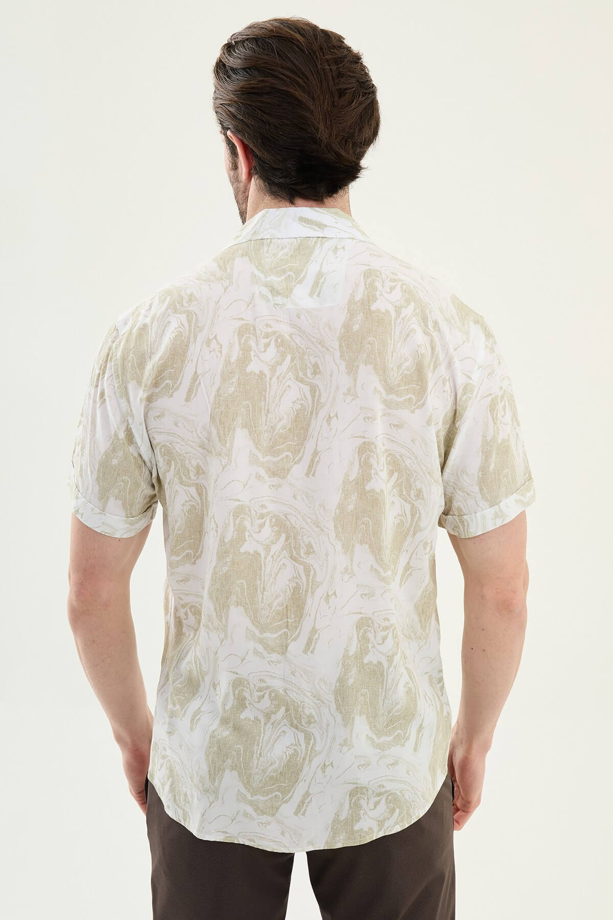 Men wearing a green palm tree printed slim-fit short sleeve shirt, styled for summer casual outings, front view.