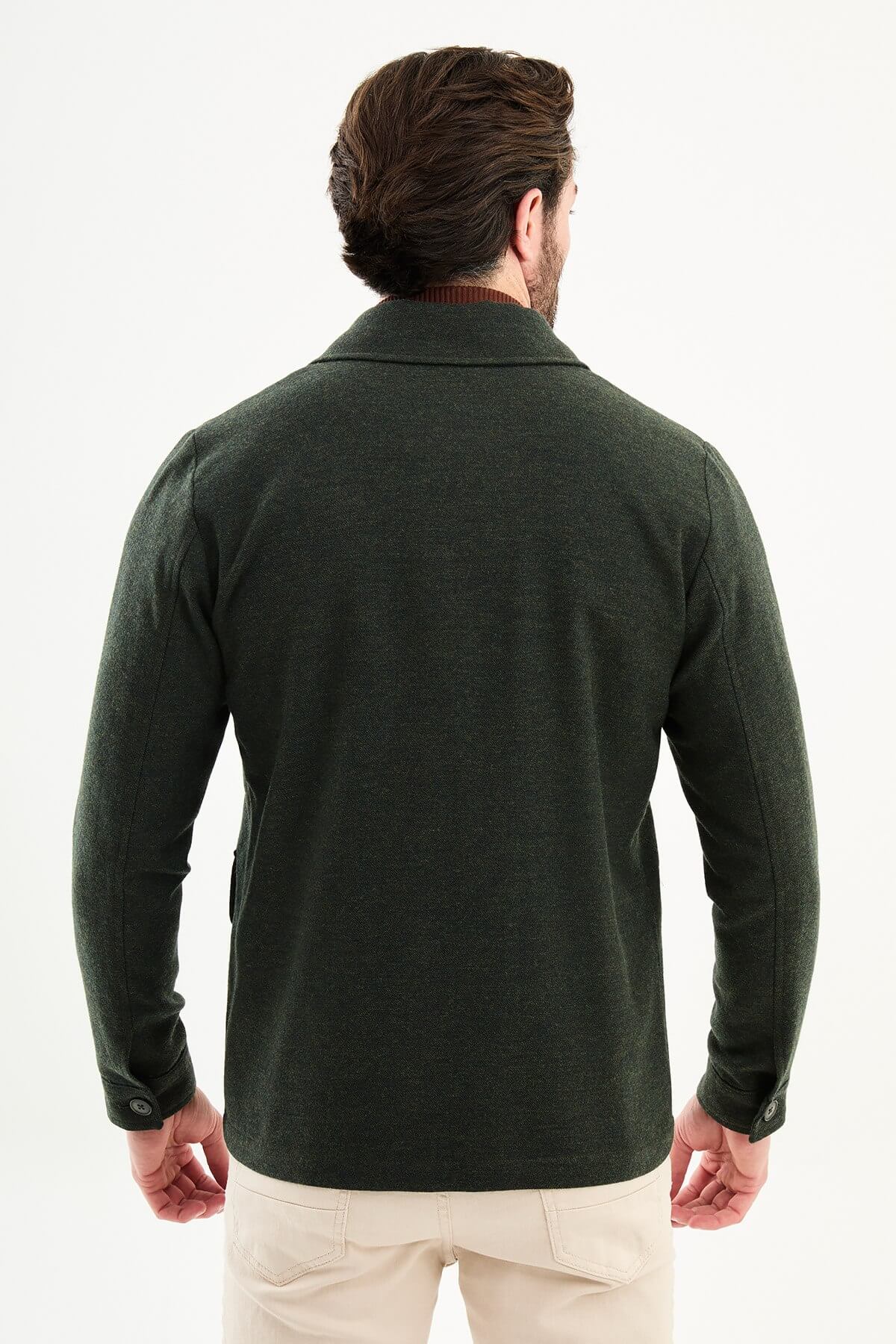 Men’s dark green wool blend utility jacket with button-up front and four pockets, regular fit smart casual layering jacket styled with beige trousers and brown turtleneck sweater