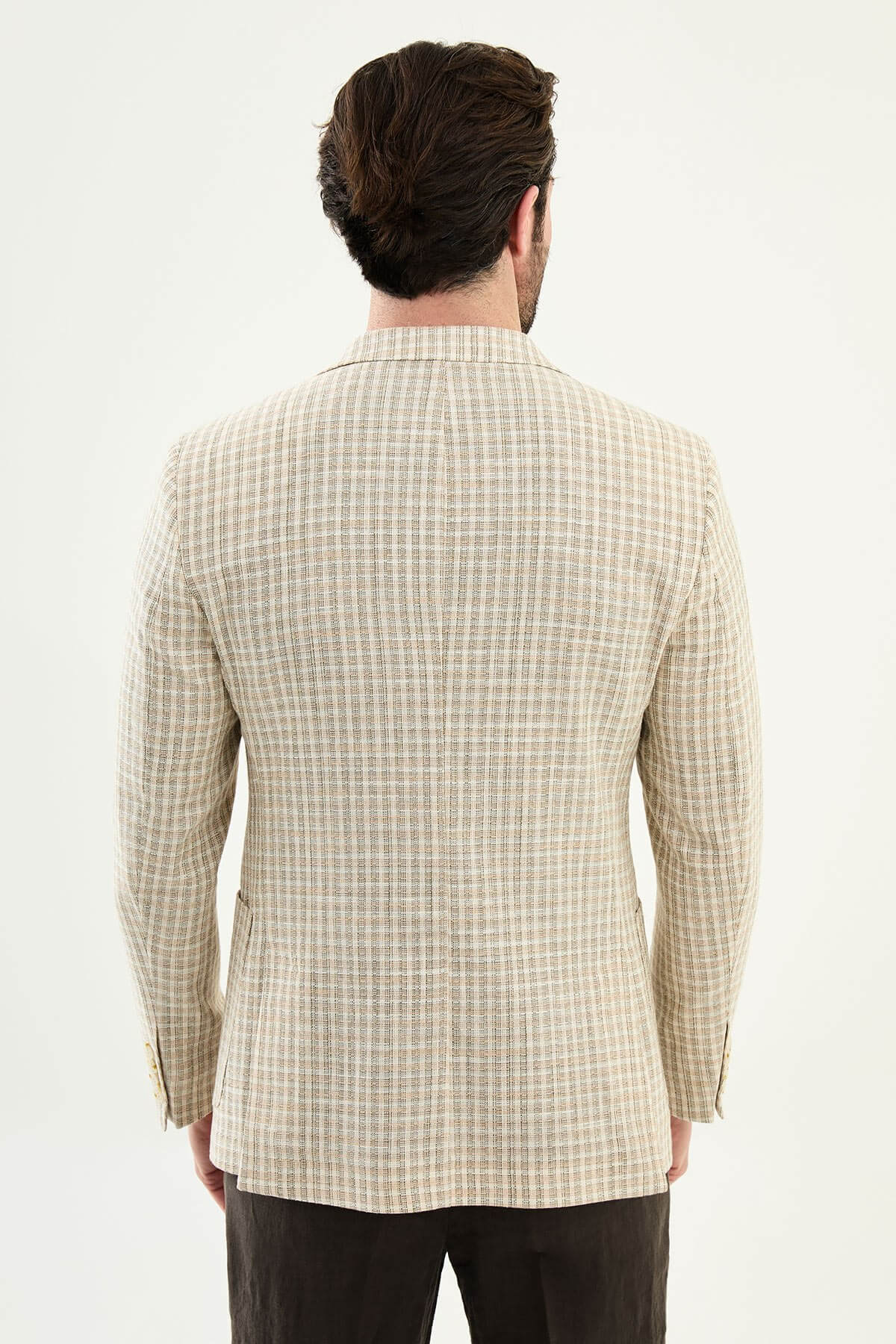 Men’s khaki slim fit cotton linen blazer with a lightweight textured pattern, styled for smart casual and elegant summer occasions.