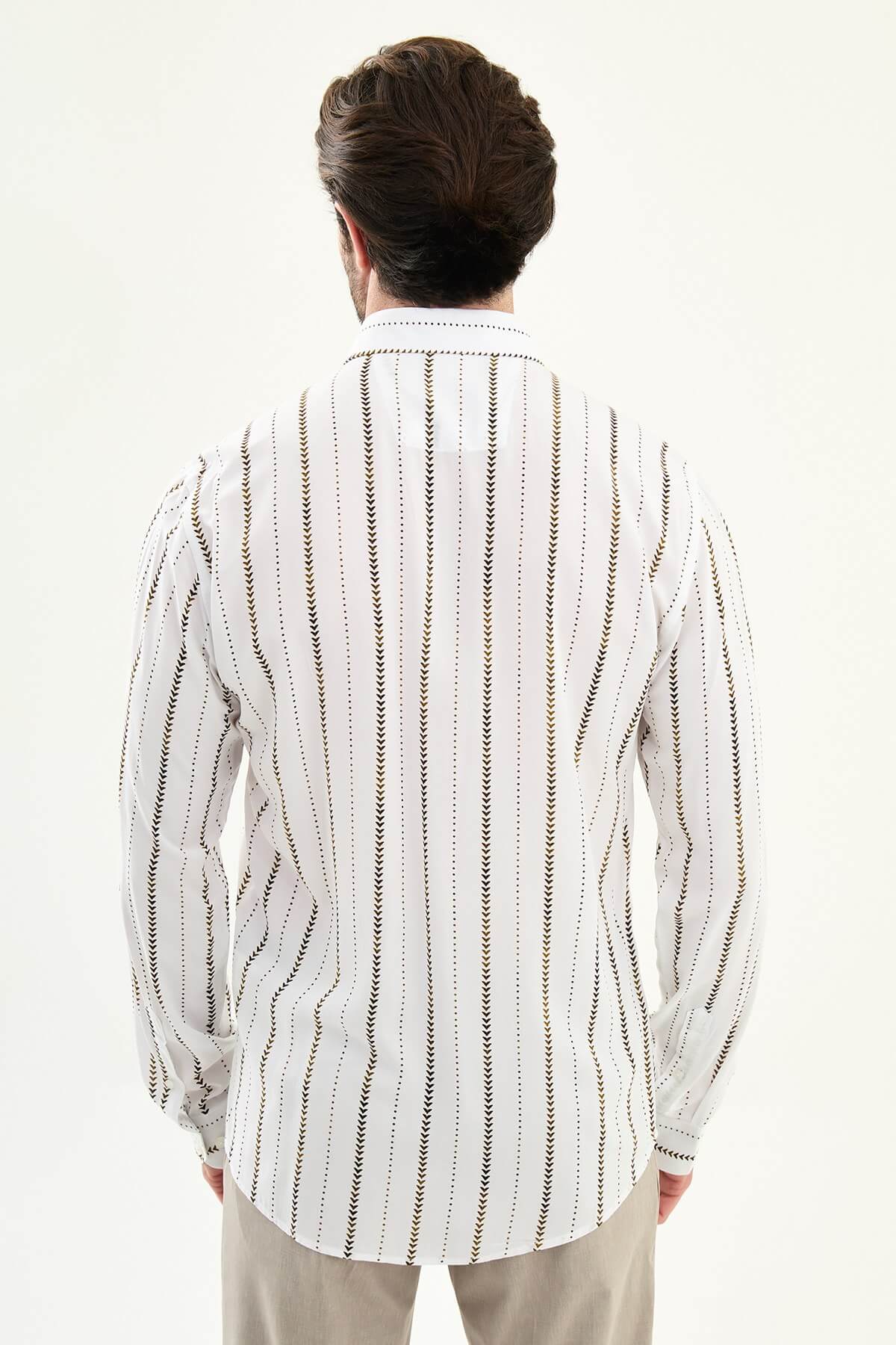 men’s slim-fit long sleeve shirt in white with brown patterned stripes, worn tucked casually with beige trousers.
