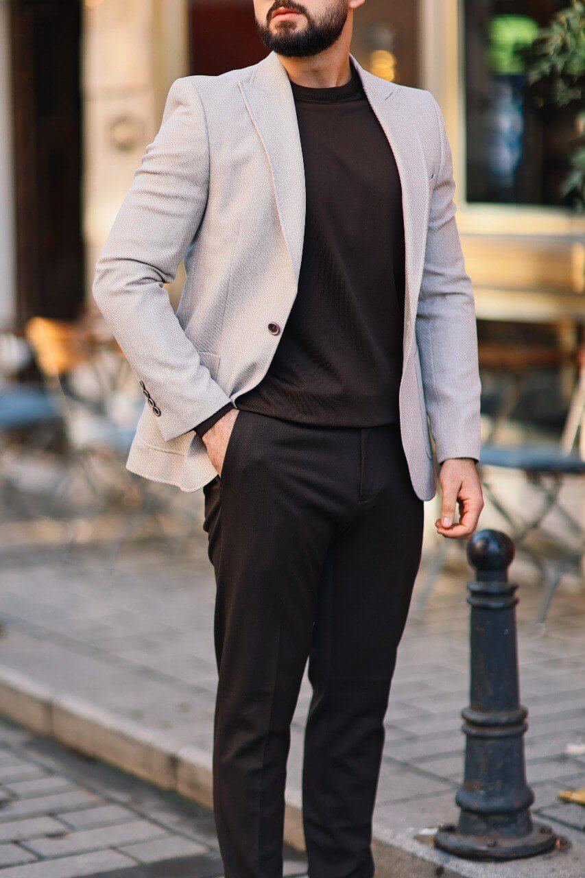 Men’s beige textured mono-collar slim-fit jacket paired with dark brown knit