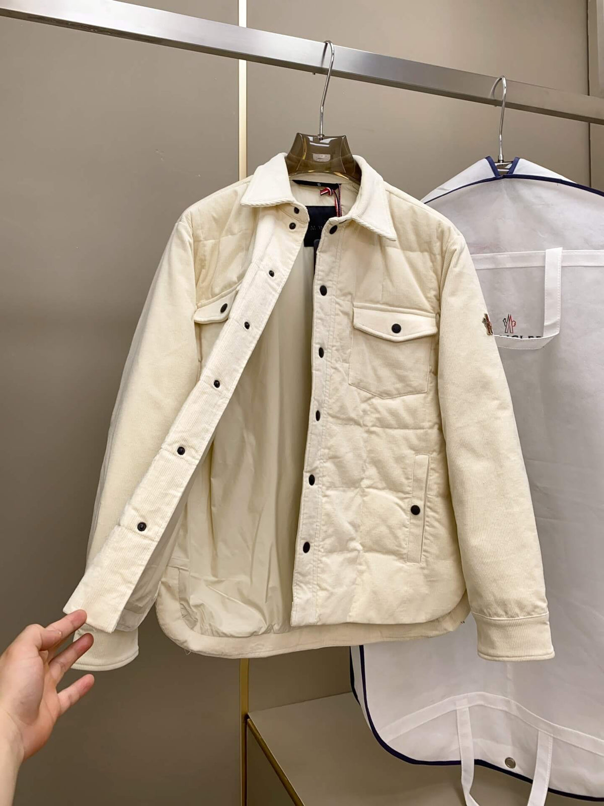 Cream corduroy down shirt jacket with quilted lining and buttoned chest pockets, Moncler-inspired design.