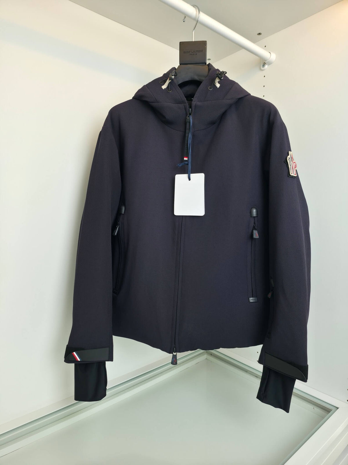 Navy hooded technical jacket with full zip closure and zippered pockets, Moncler-inspired design
