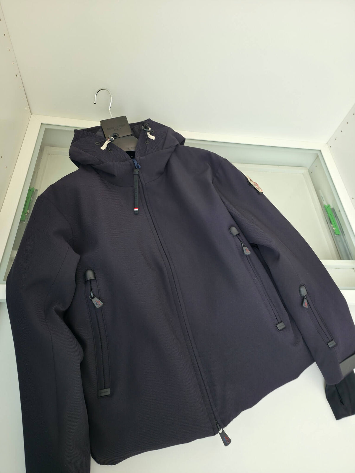 Navy hooded technical jacket with full zip closure and zippered pockets, Moncler-inspired design