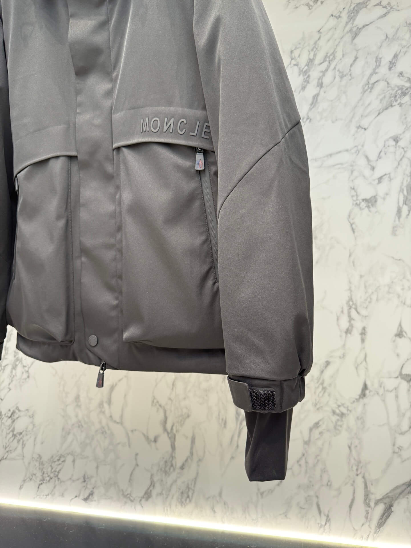 Moncler Maya Black Short Down Jacket open view showing quilted interior and label.