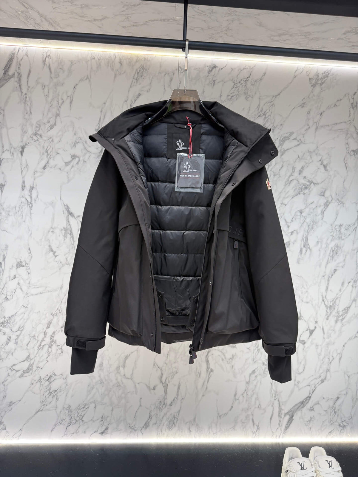 Moncler Maya Black Short Down Jacket open view showing quilted interior and label.