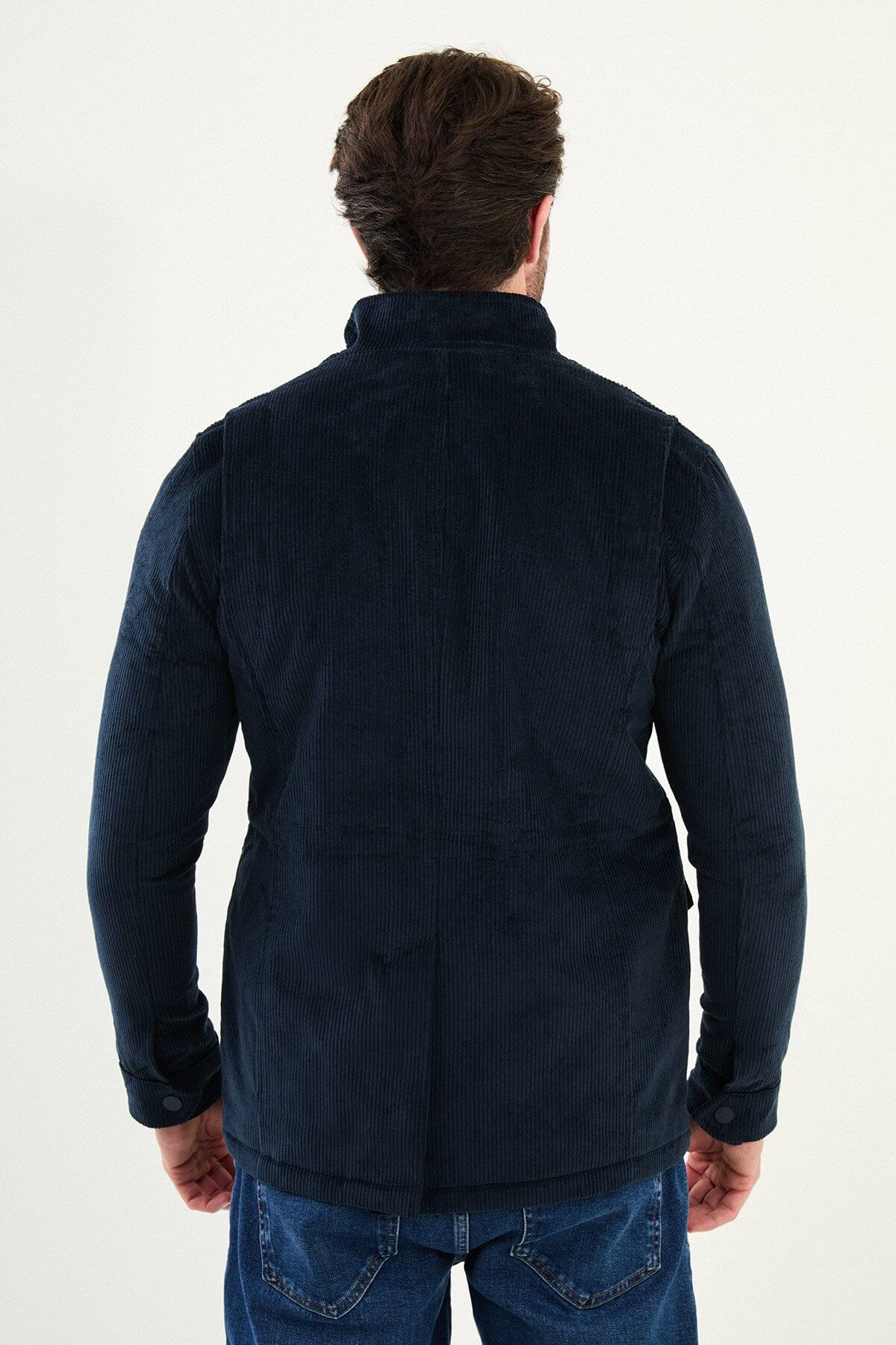 Men’s navy blue corduroy utility jacket with zip and button closure, multiple pockets, regular fit smart casual layering jacket styled with blue jeans and white knit sweater