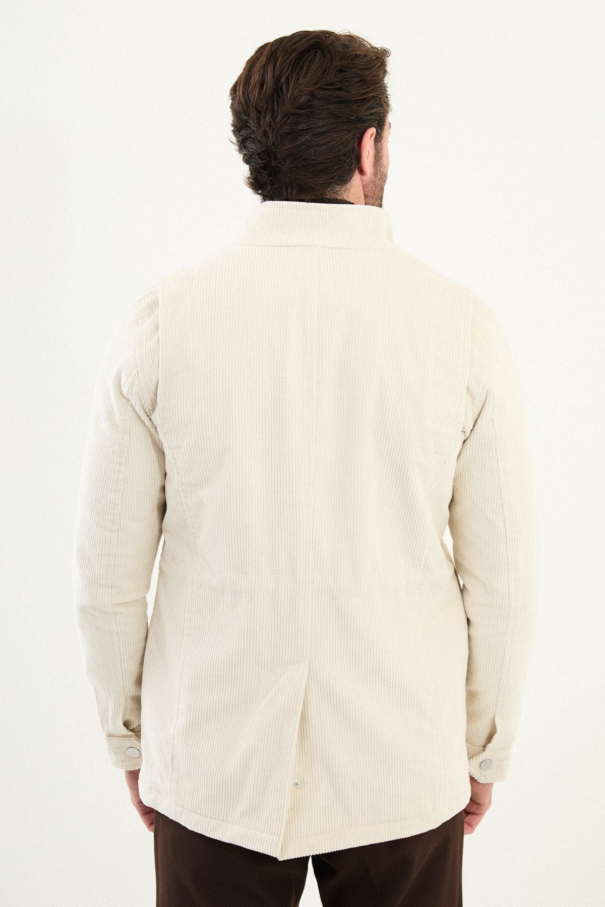 Men’s off-white corduroy utility jacket with zip and button closure, multiple pockets, regular fit smart casual layering jacket styled with brown trousers and dark turtleneck sweater