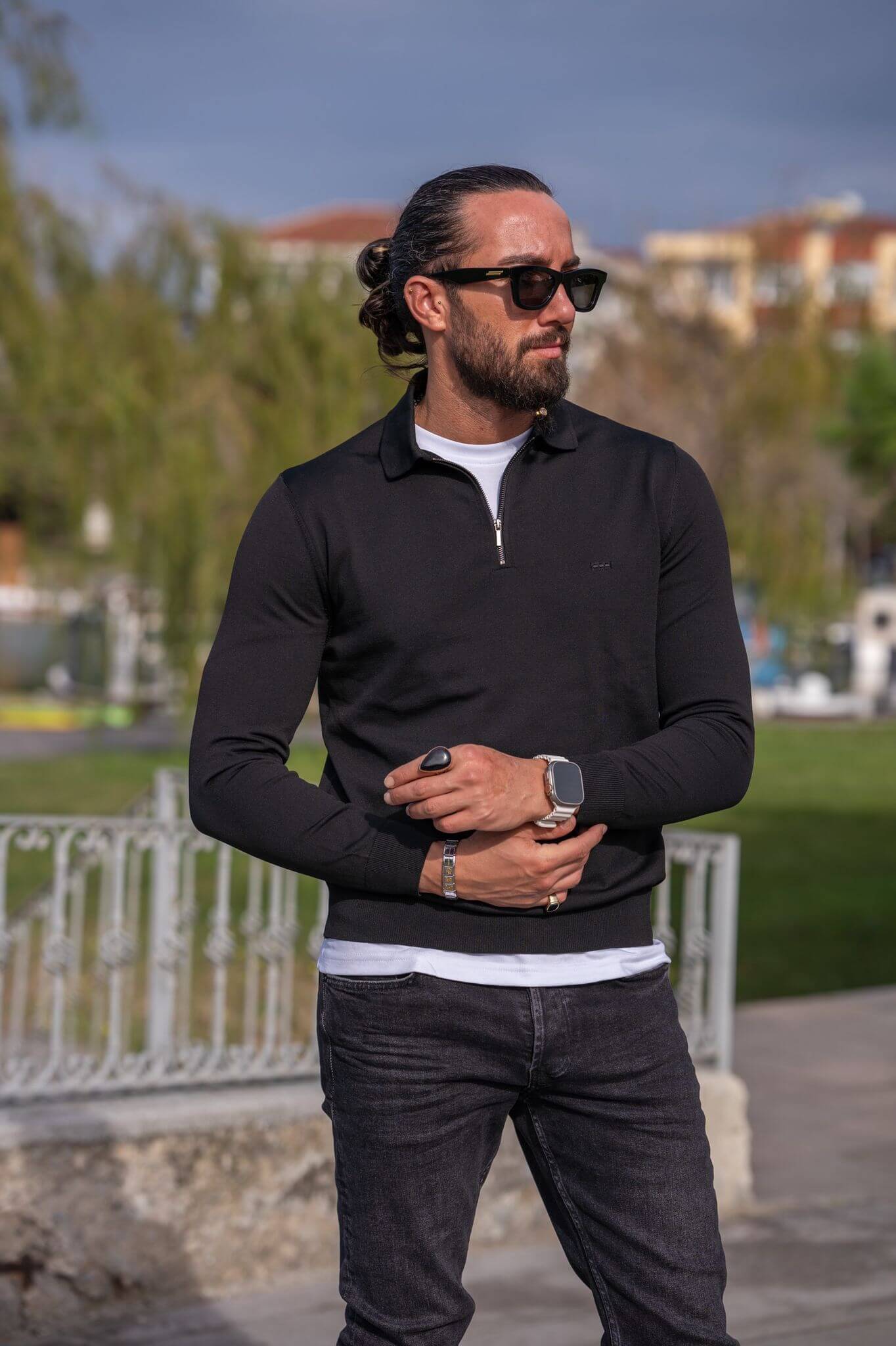 A male model wearing our Black Zipper Detailed Knitwear, exuding style and sophistication with a focus on the unique zipper