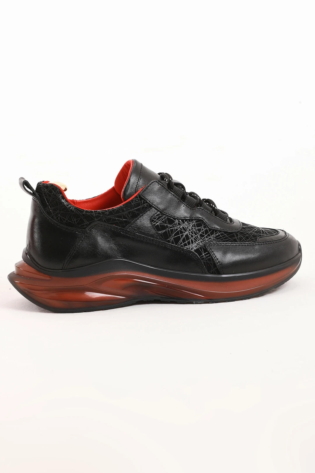 Men's black sneaker with embossed side detailing and red lining, front view