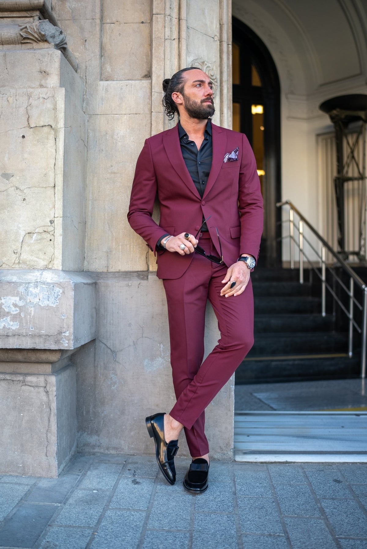 Burgundy tuxedo peak lapel and two button jacket, side angle detail