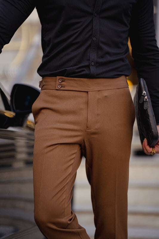 A Camel Fabric Trousers on display.