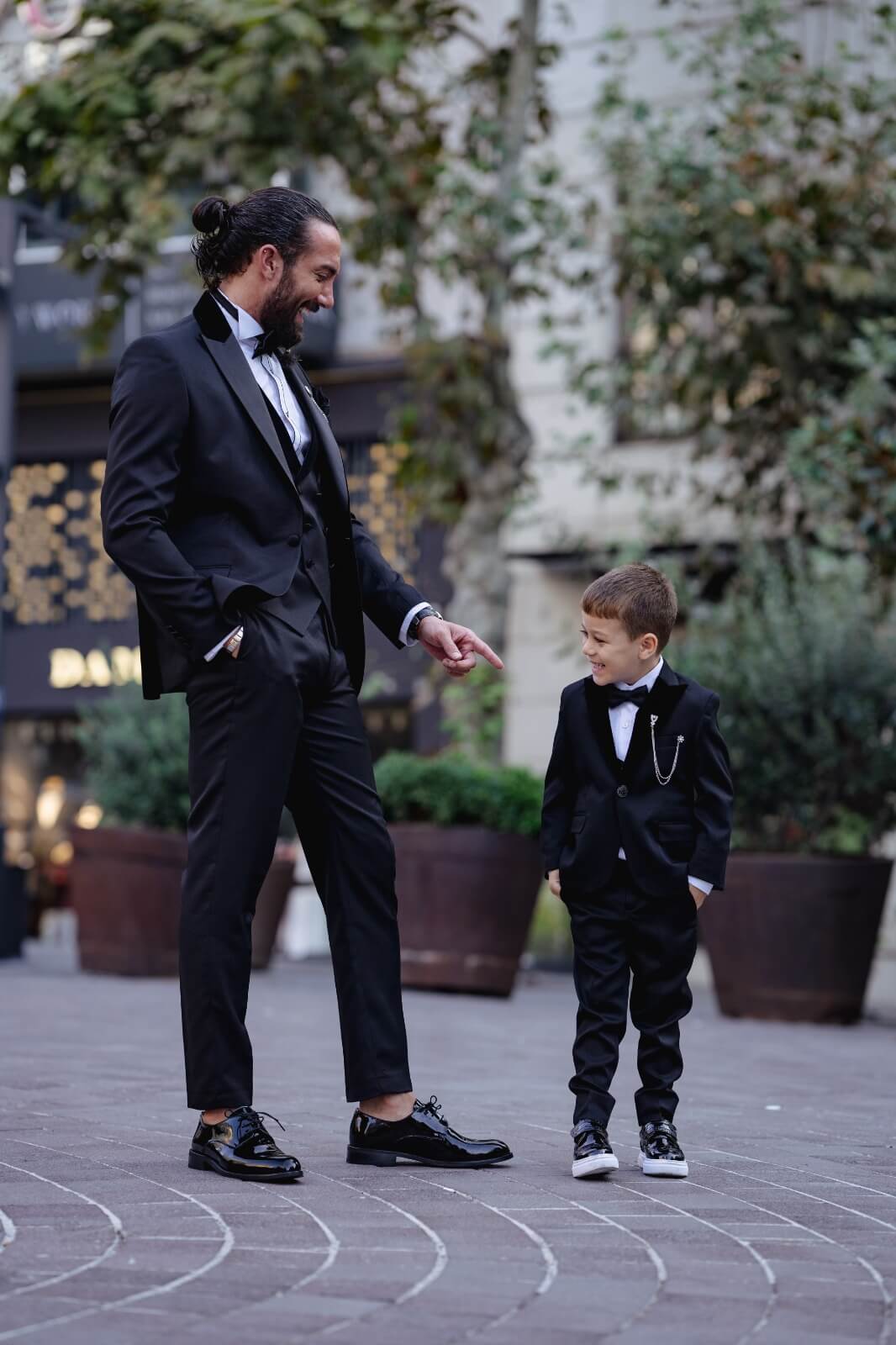 A slim-fit black boys’ tuxedo from HolloMen's Fall-Winter collection, designed with a single-button jacket, double slits, and full lining — perfect for weddings and formal occasions.