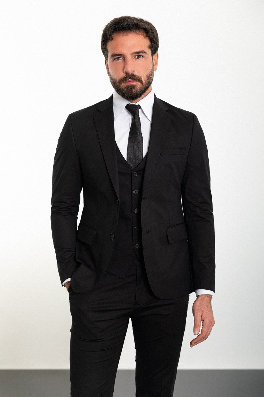 Man wearing a slim fit black suit from HolloMen's Spring Summer Collection.