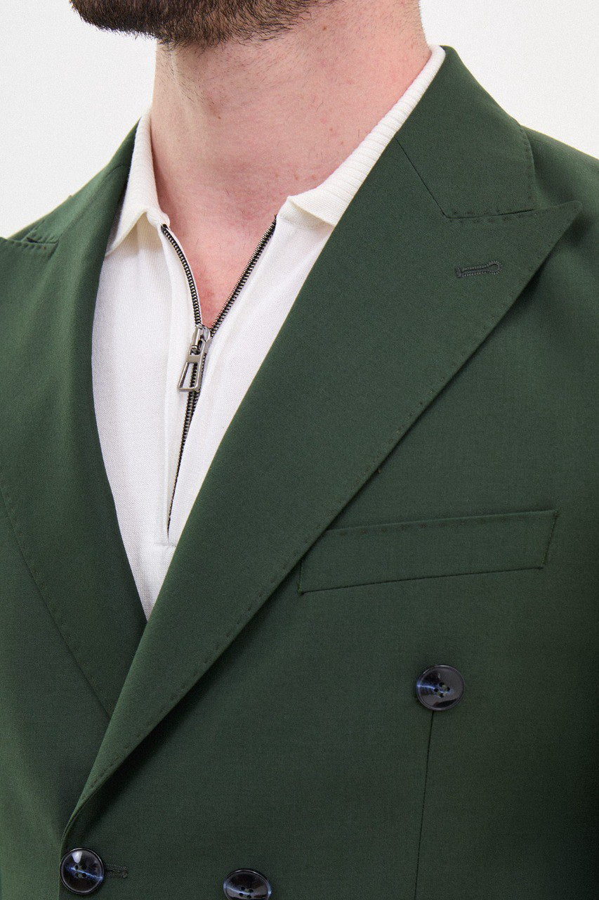 Man wearing a double-breasted khaki suit from HolloMen’s Spring Summer Collection, showcasing modern tailoring and versatility.