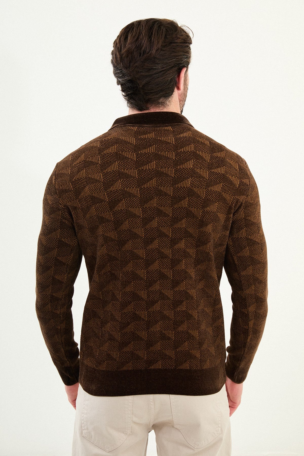 A male model wearing a brown patterned slim fit knitwear sweater with a half-zip and polo collar.