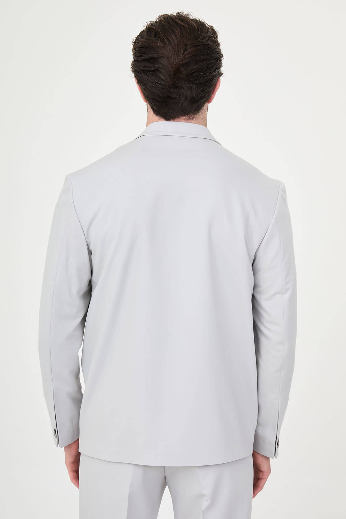 Light Gray Slim Fit Men’s Suit, two-piece formal suit jacket and trousers, styled with black dress shoes, perfect for weddings and business events.