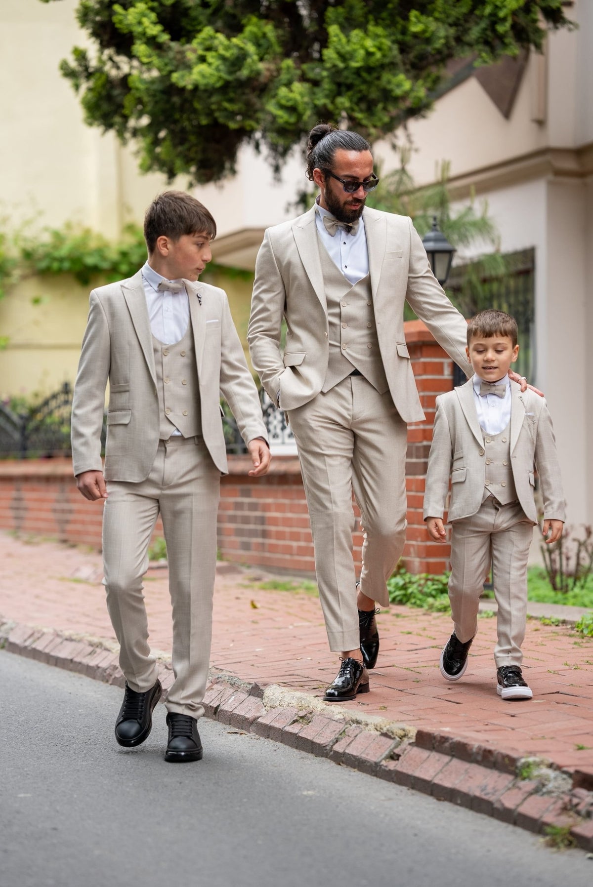 Beige boys tuxedo trousers and jacket pairing detail