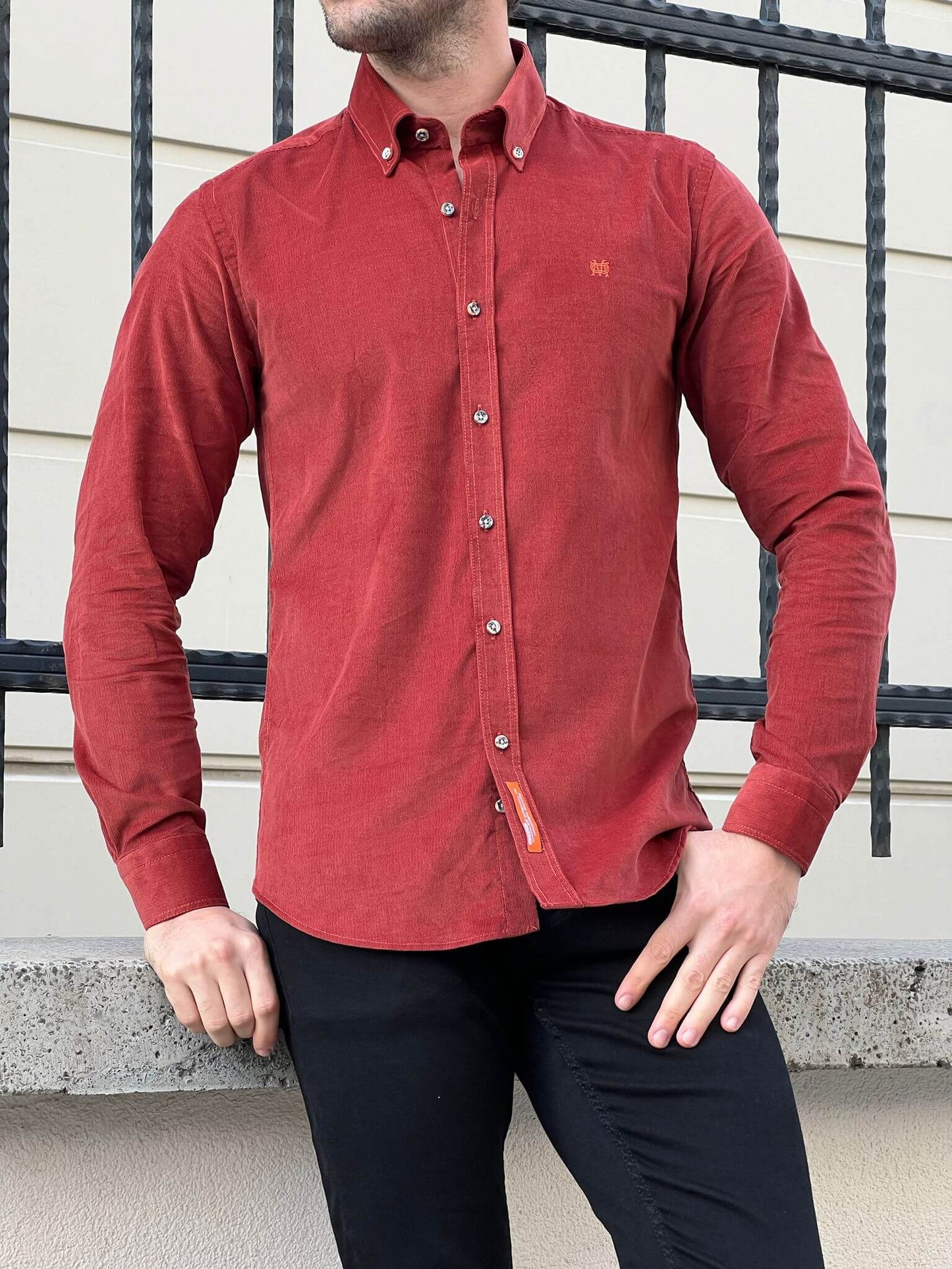 A male model in the Velvet Tile Shirt, exuding style and sophistication with a touch of urban flair.