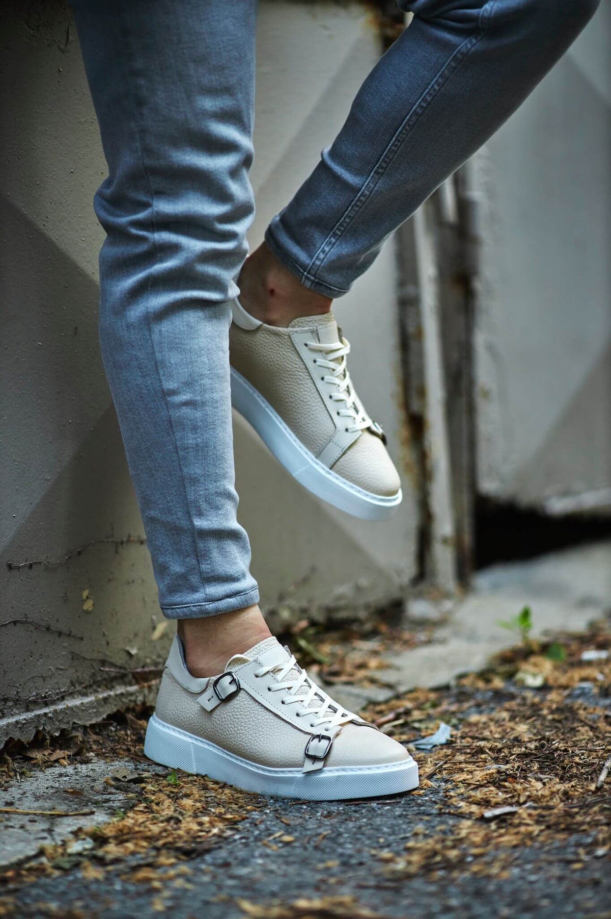 A Beige Detailed Sneaker on display.