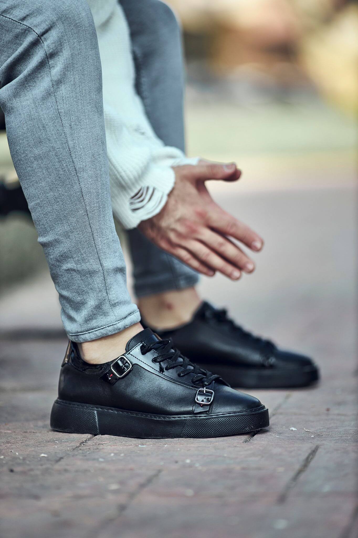 A Black Detailed Sneaker on display.