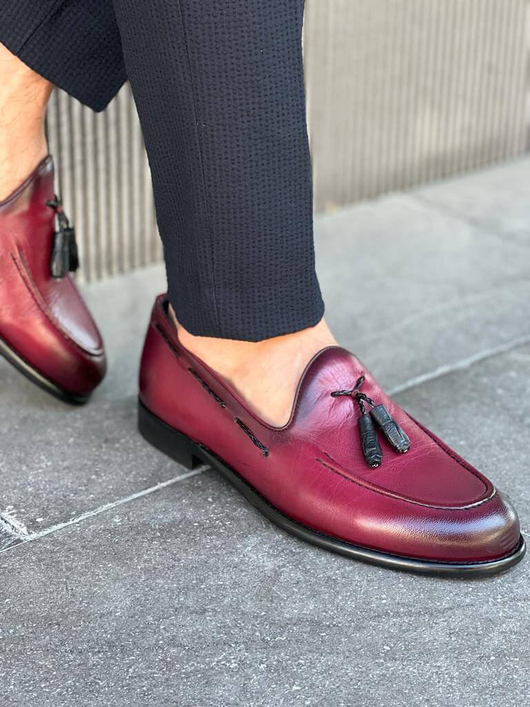 Elegant burgundy leather loafers with tassel detailing and neo-lite soles, designed for stylish spring and summer wear.