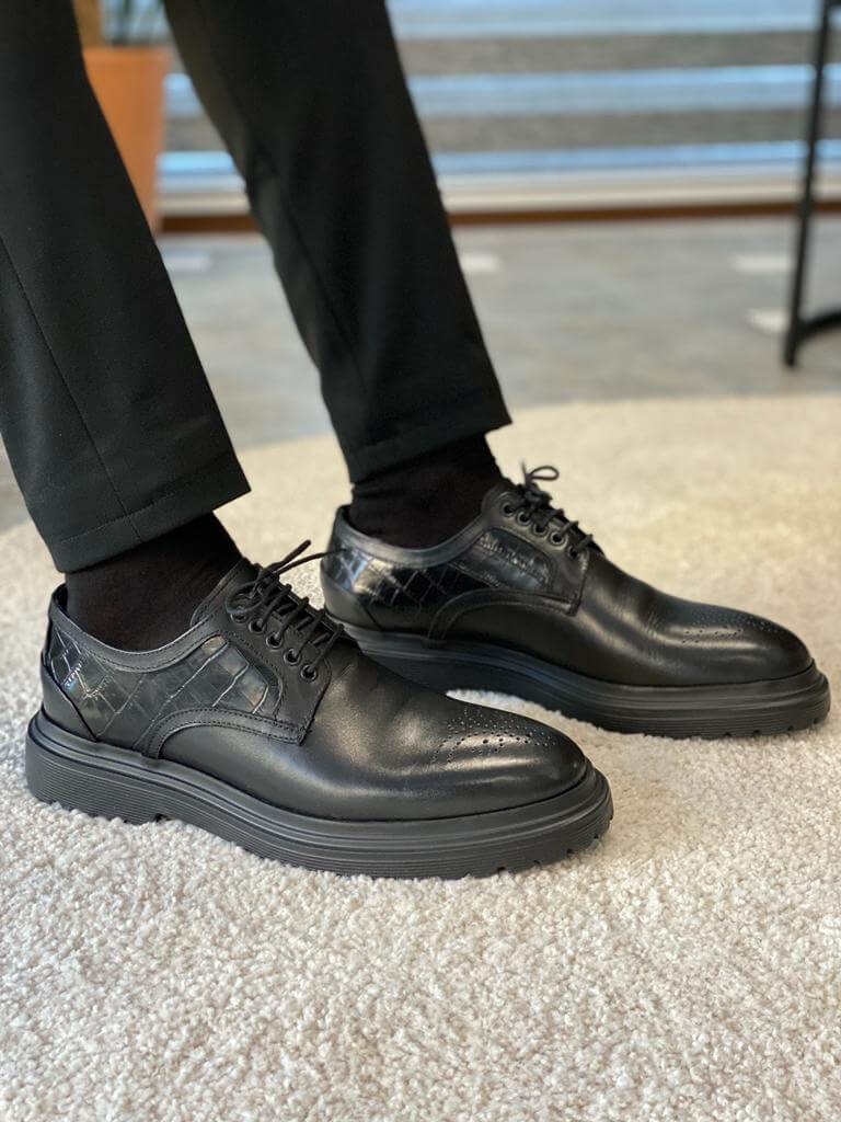 Premium black leather derby shoes displayed against a neutral background. Featuring sleek stitching, polished finish, and durable EVA soles—perfect for formal and business wear.