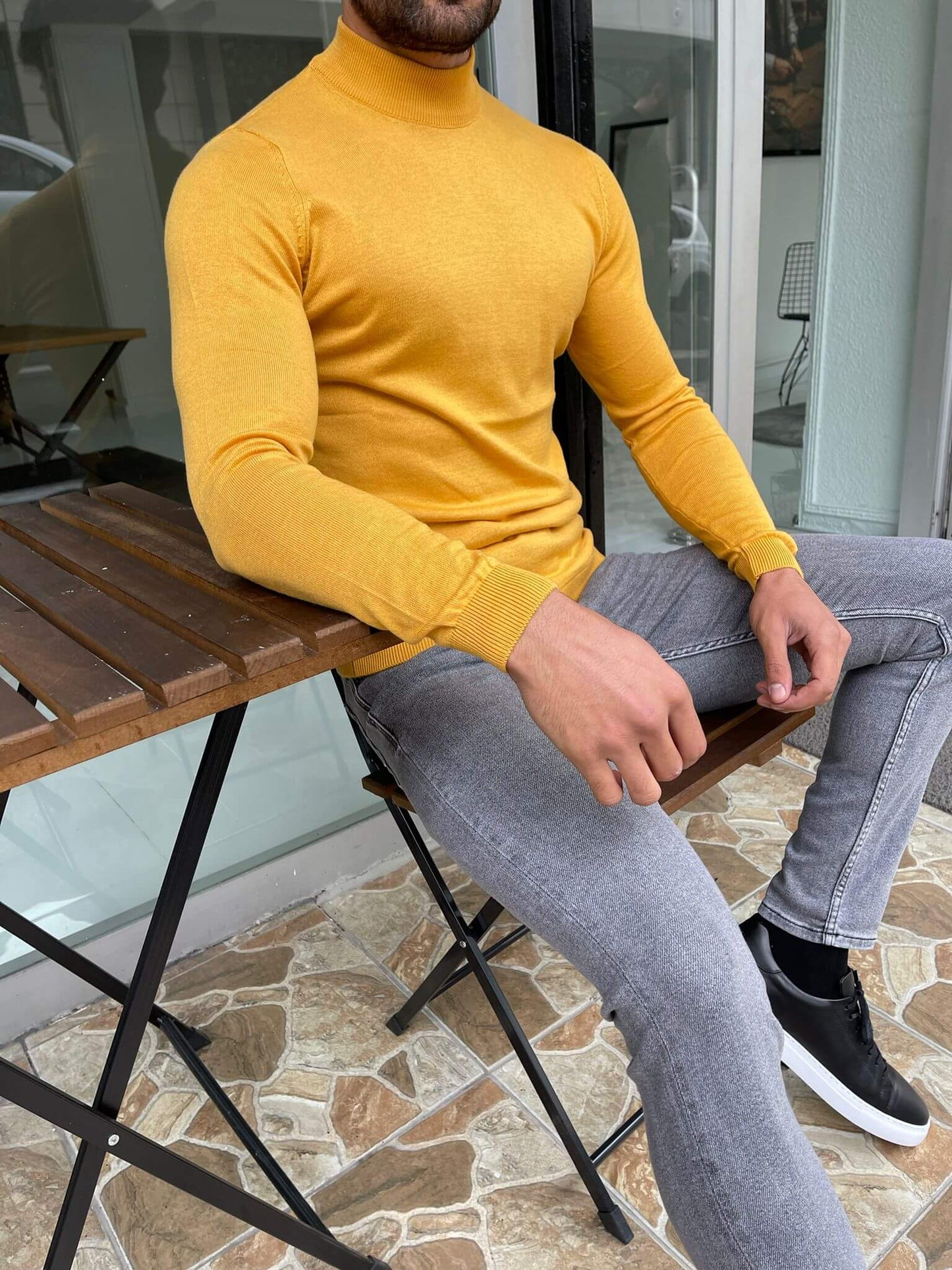 "An Osaka Mustard Half Turtleneck sweater, featuring a warm mustard color, a cozy half turtleneck collar, and a stylish design perfect for cooler weather."