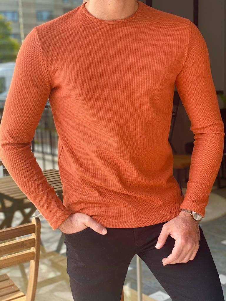 A slim fit orange crewneck sweater, featuring a comfortable crew neckline and a snug fit, perfect for casual or semi-formal occasions."