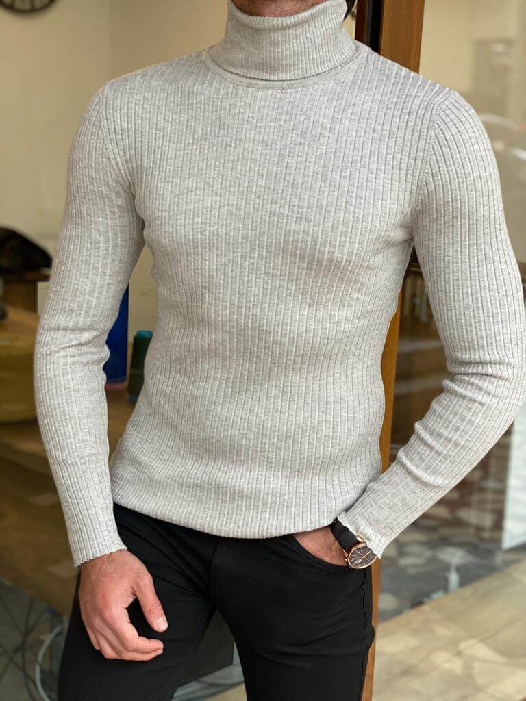 Close-up of a fashionable Striped Lycra Turtleneck, featuring bold vertical stripes in various colors, designed to fit snugly around the neck and torso."