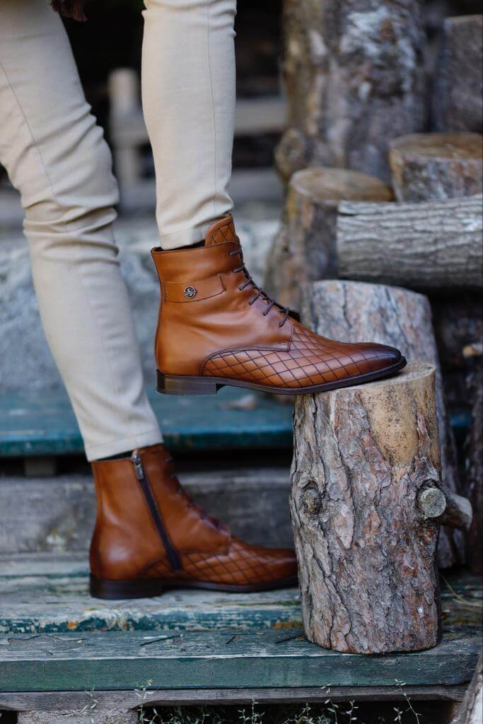 Wistman camel classic boots worn with cream trousers, highlighting the grid-patterned leather and clean finish.