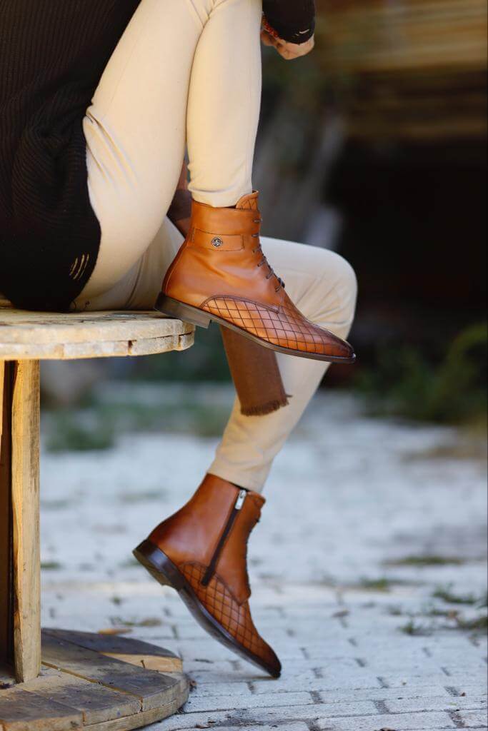 Wistman camel classic boots worn with cream trousers, highlighting the grid-patterned leather and clean finish.